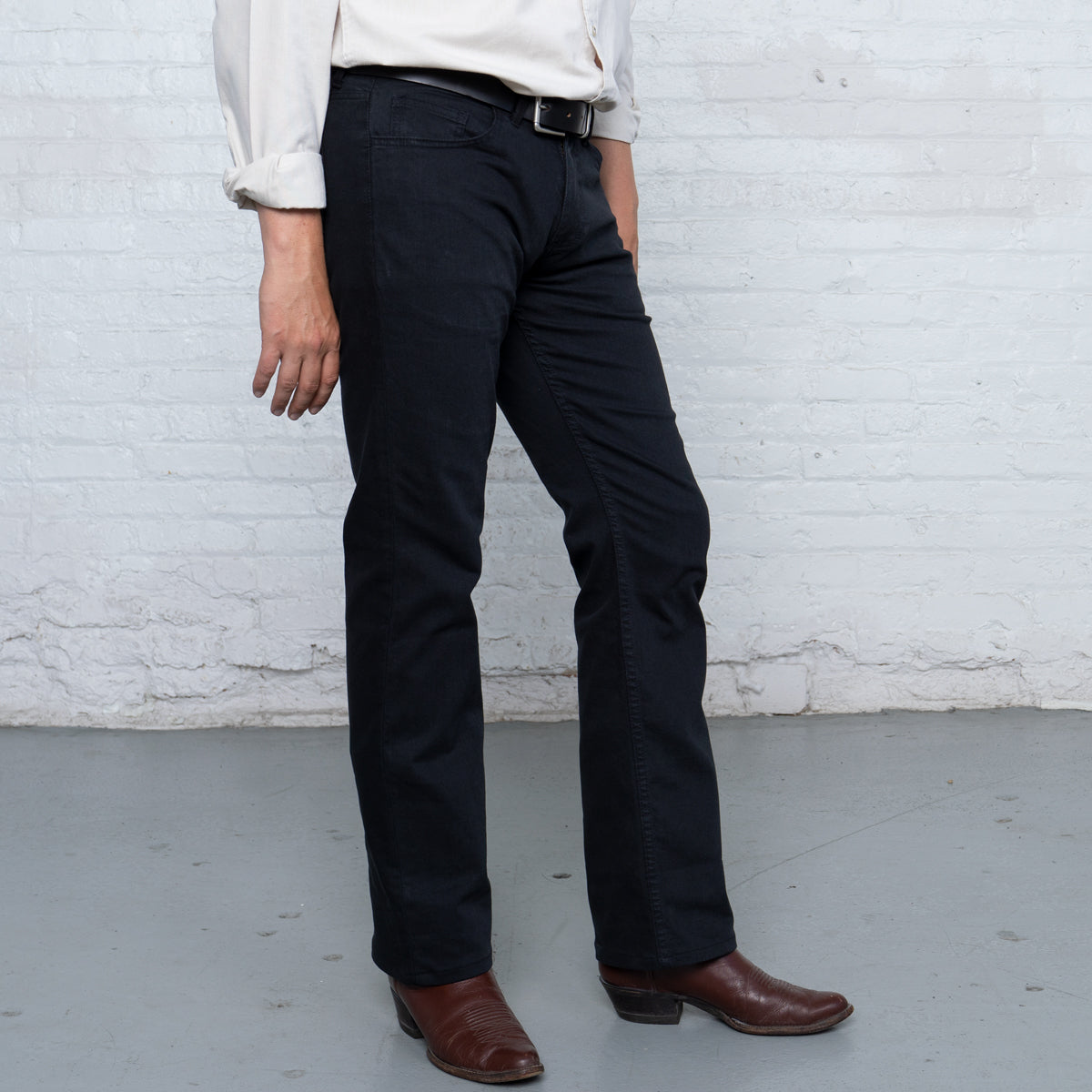 Close-up of the black tri-blend stretch denim weave and stitching