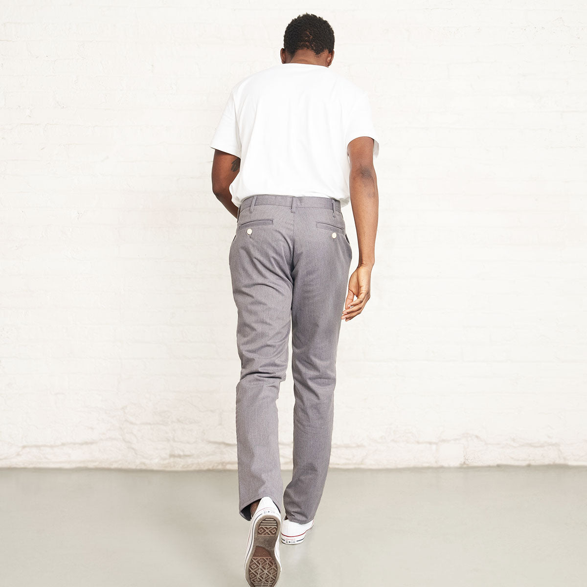 Close-up of the branded Italian button and waistband on the grey chino