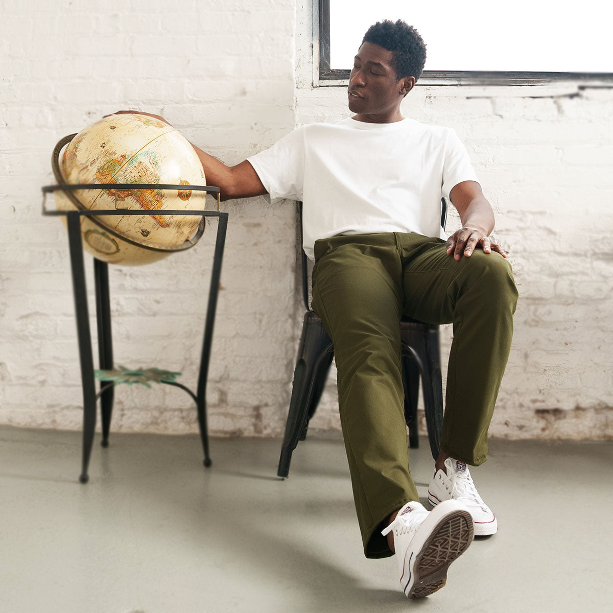 Close-up of the 14.5 inch leg opening and hem on olive chinos