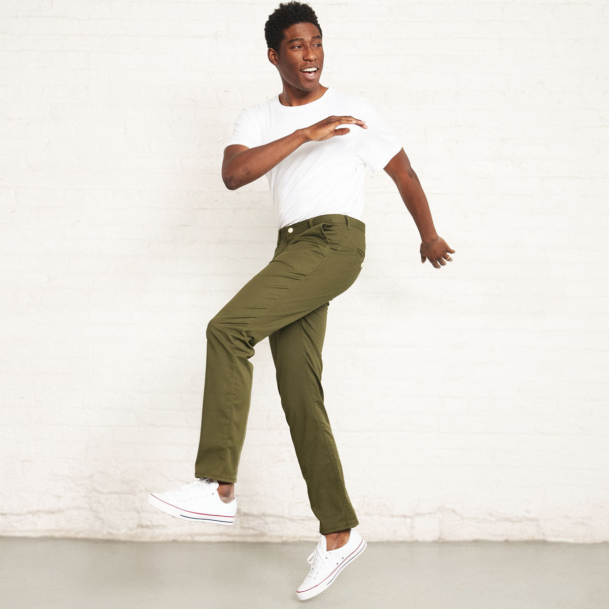 Olive stretch chinos styled with a shirt for business casual wear