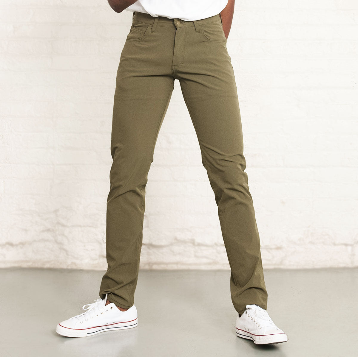Olive Tailored Technical jeans shown front view on a white background