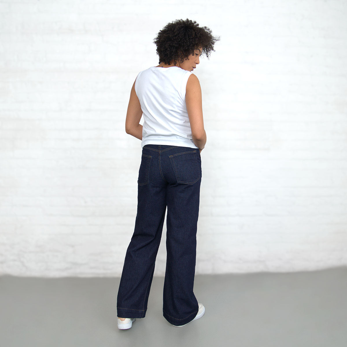 Model standing in Palazzo wide-leg jeans with a tucked top