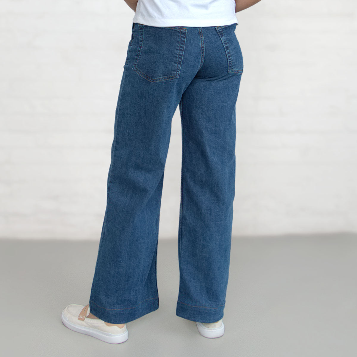 Three-quarter view showing the wide leg falling from the hip