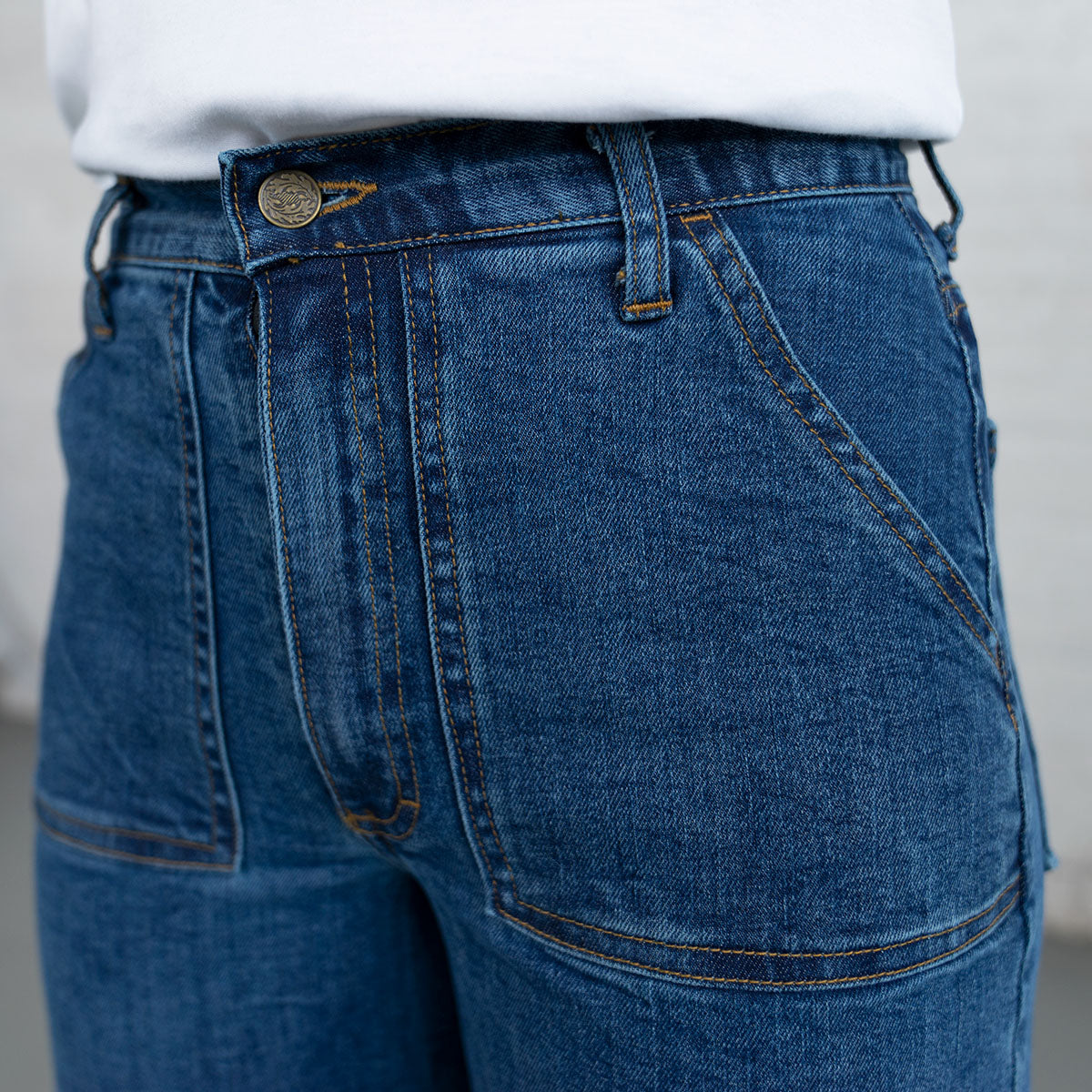 Detail of the YKK zip-fly and button closure