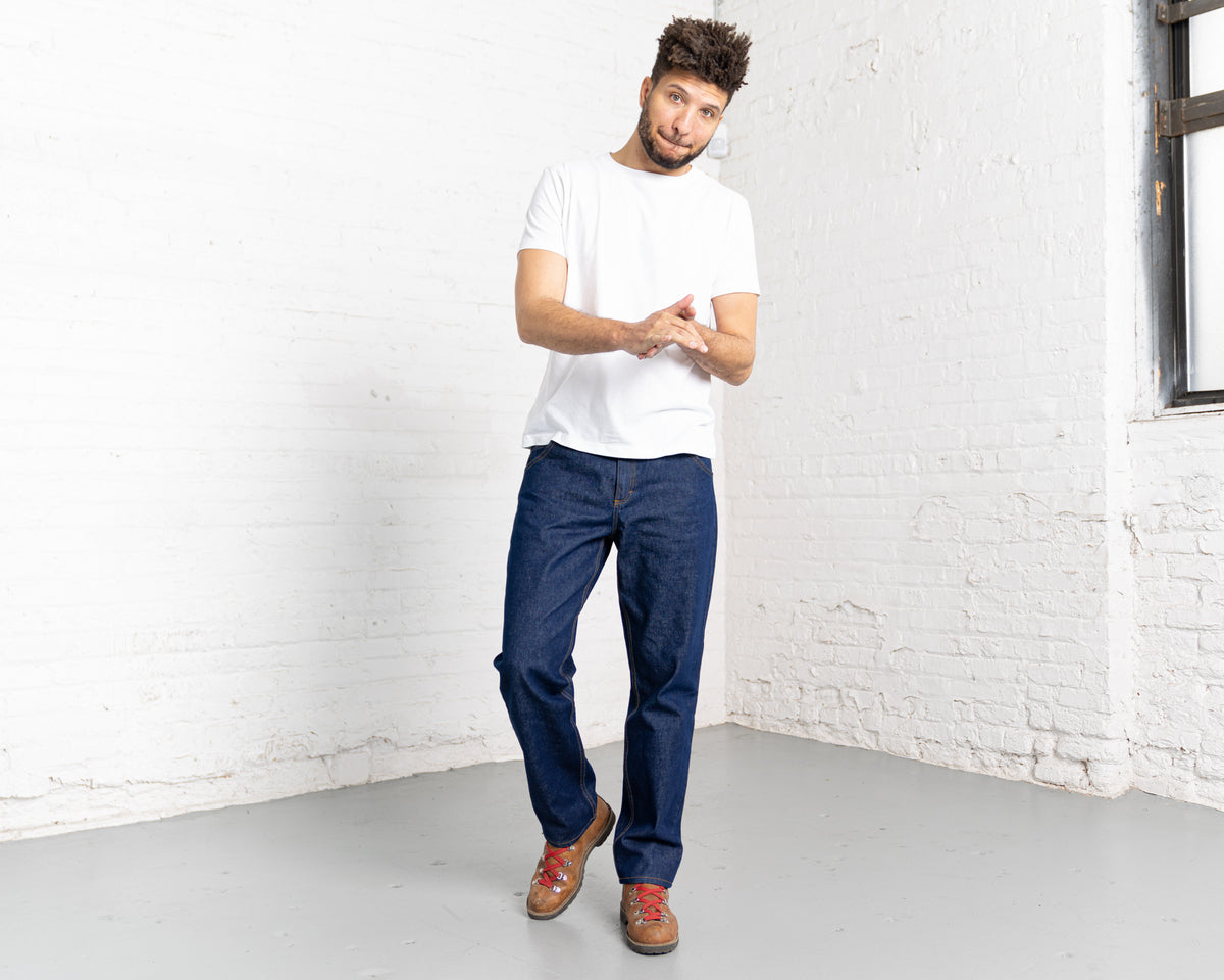 Detail of the 100% cotton 13oz dark indigo denim fabric and stitching.