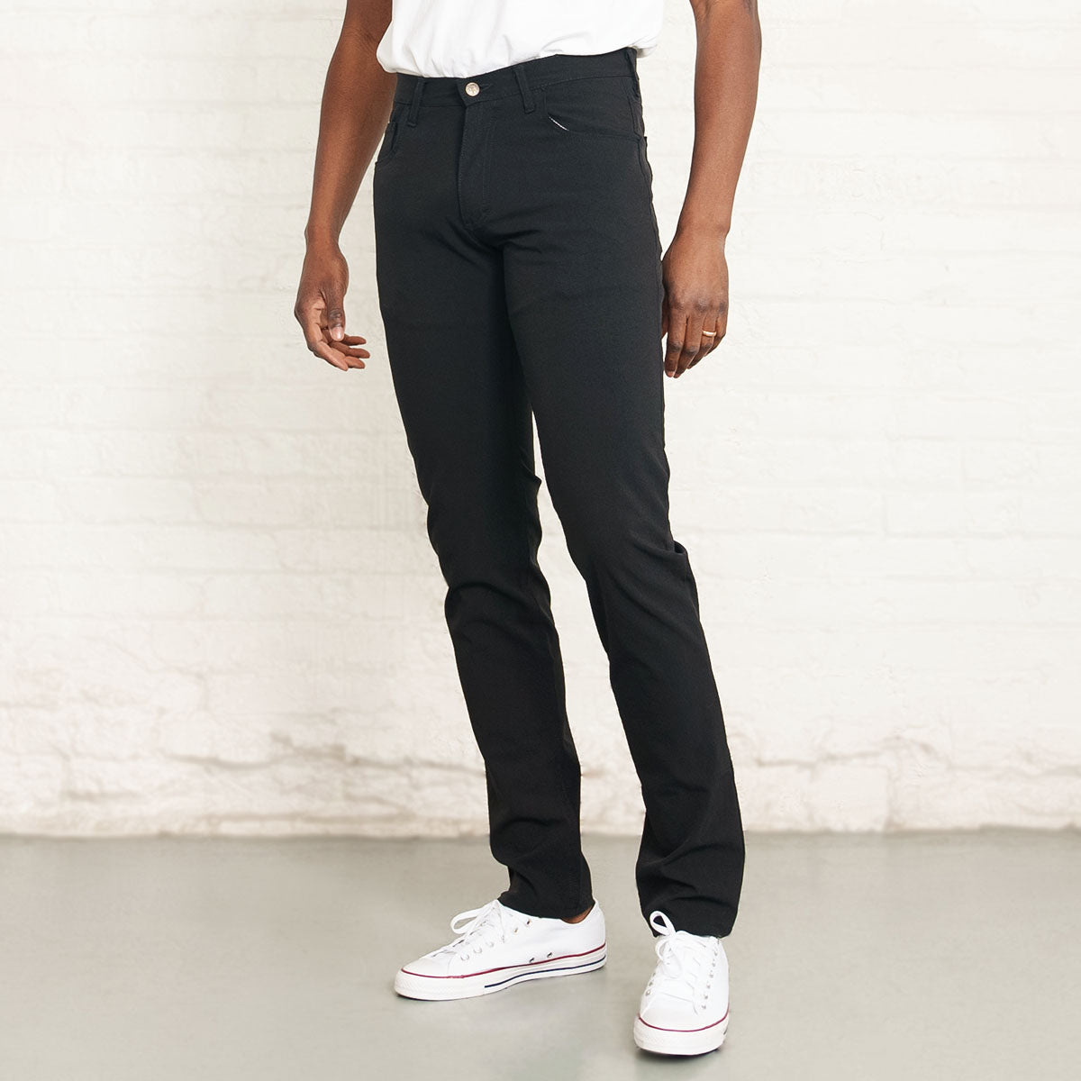 Black Tailored Fit technical pants shown flat, front view
