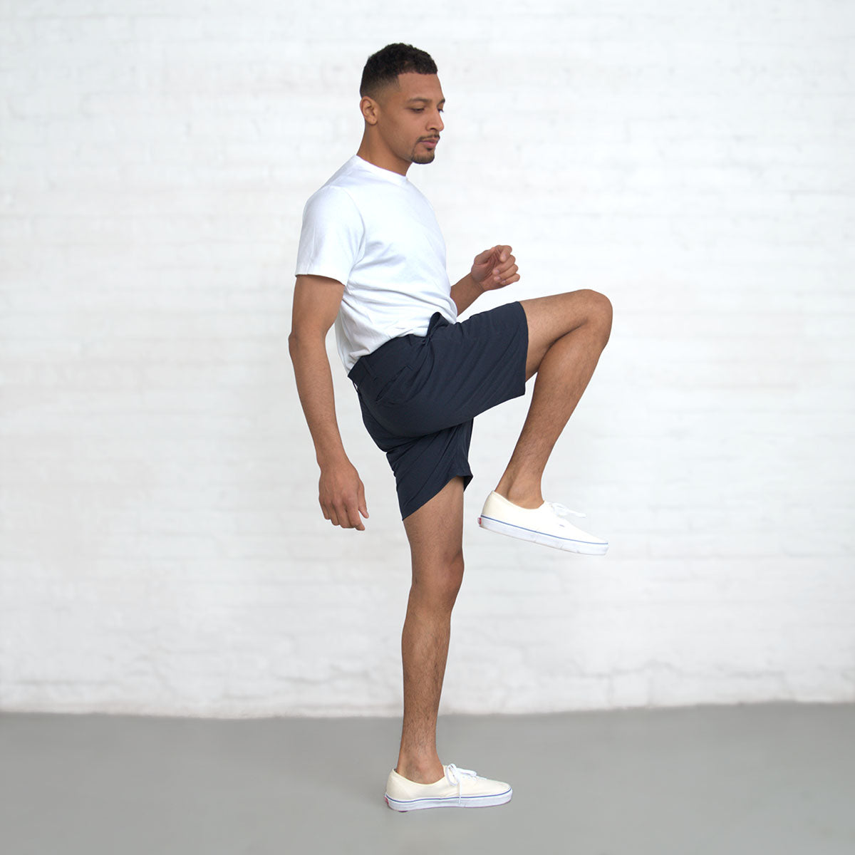 Water beading on the surface of the navy shorts from the DWR finish.