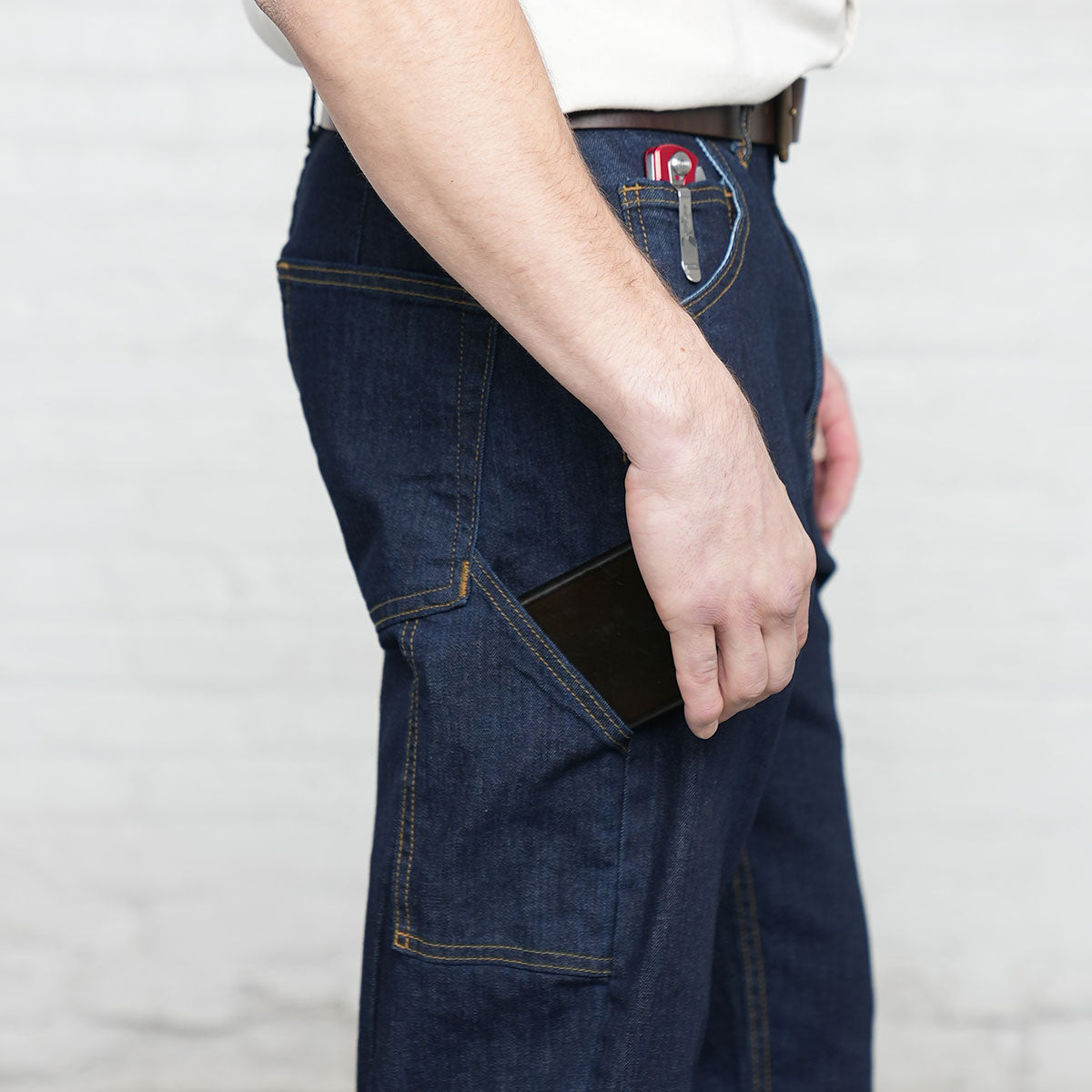 Close-up of the dark indigo TriBlend stretch denim fabric and stitching