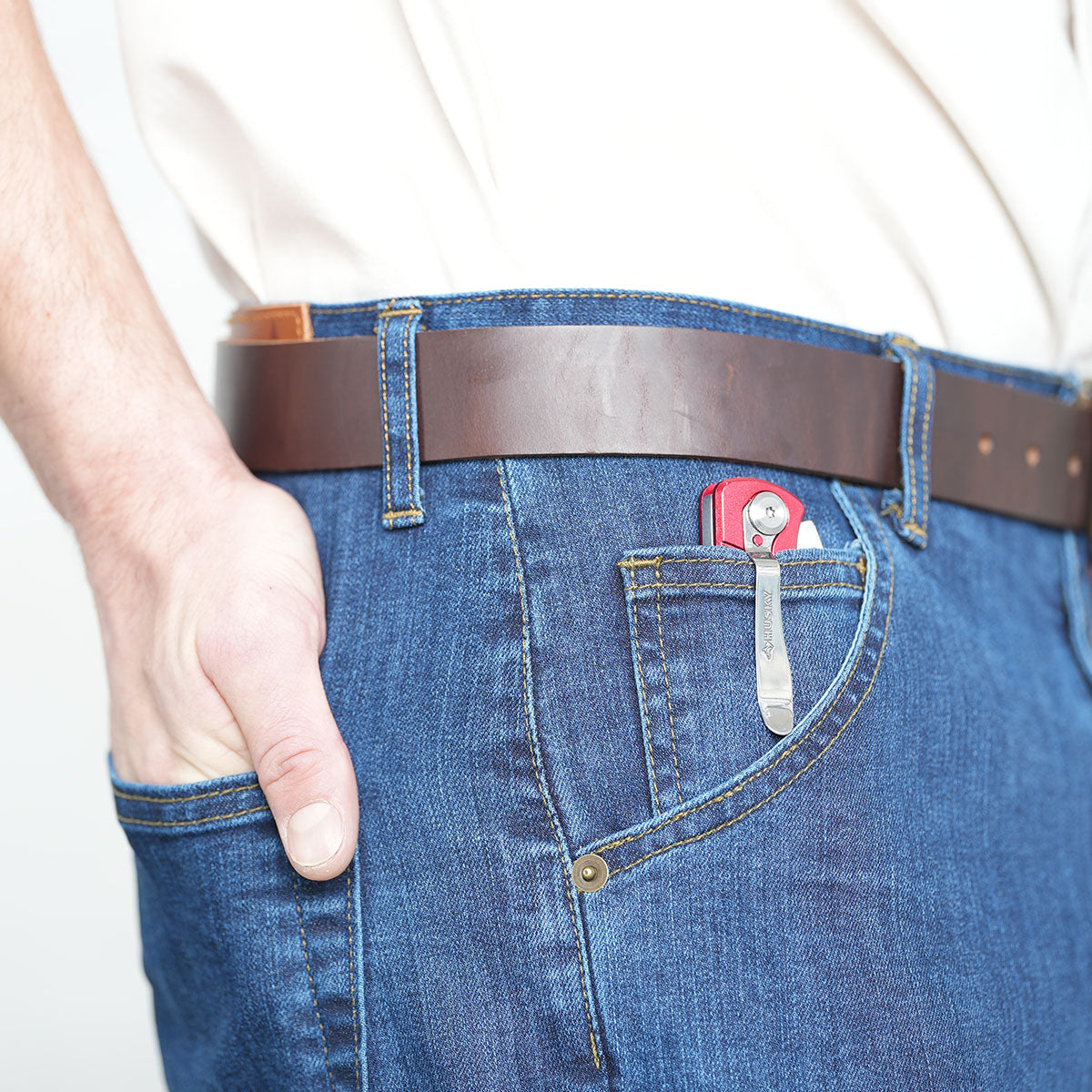 Man wearing medium wash carpenter jeans, full-length side view