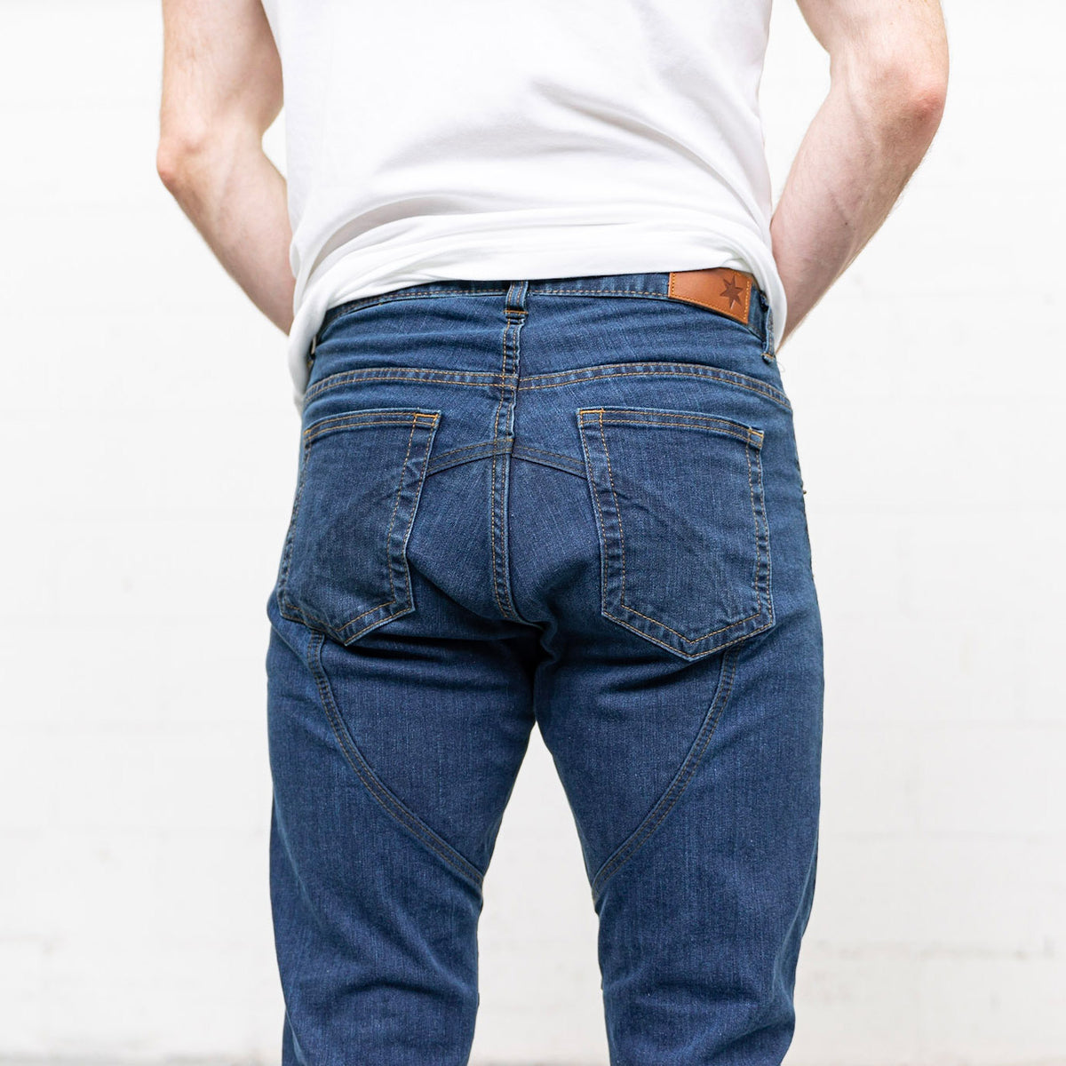 Detail of the back pocket stitching and reinforced seat on Commuter jeans.