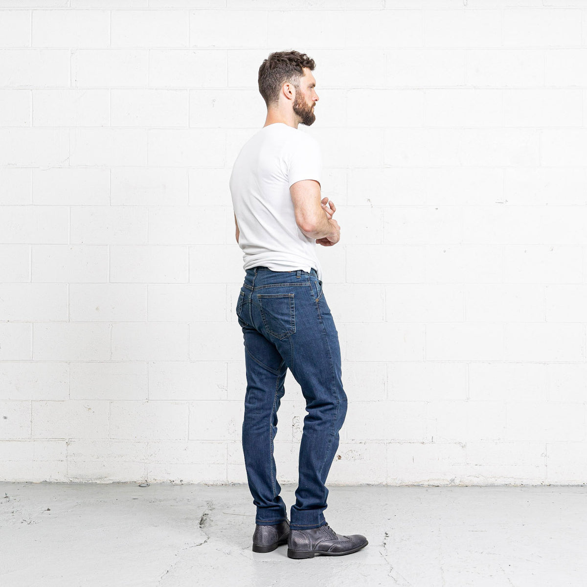Close-up of the front pocket and YKK zipper fly on Commuter medium wash jeans.