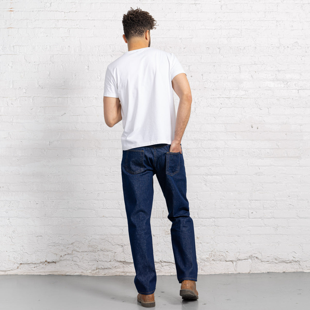Close-up of the front pocket, belt loops and YKK zipper fly on dark wash 13oz cotton denim.