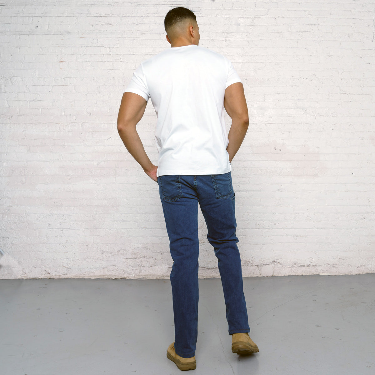 Side view of relaxed fit jeans showing the sixth welt pocket on the side seam