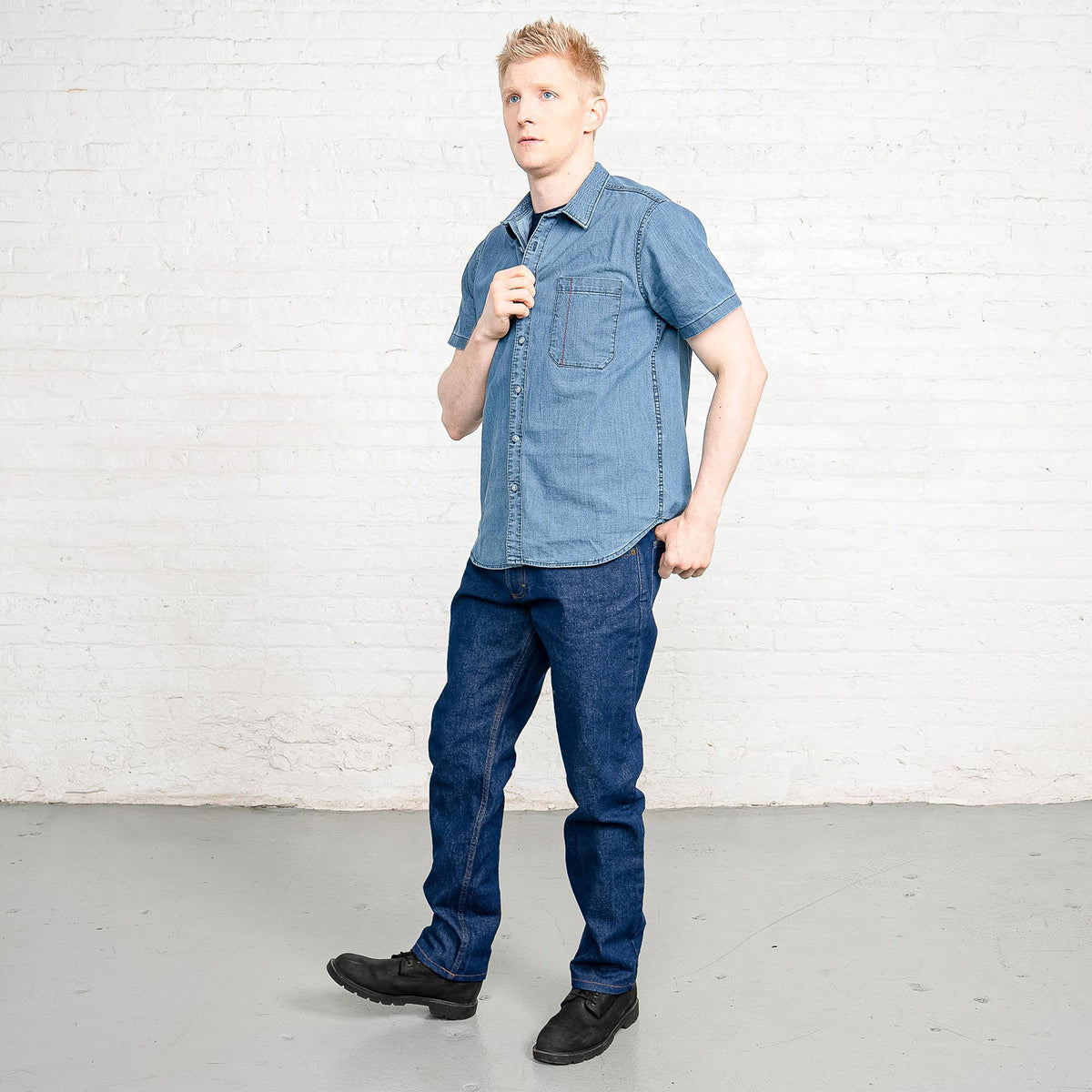 Back view of dark wash Tailored Fit jeans showing back pockets and Horween leather patch