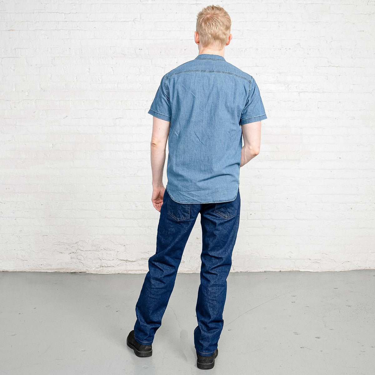 Close-up of the front pocket and YKK zipper fly on dark wash cotton denim jeans