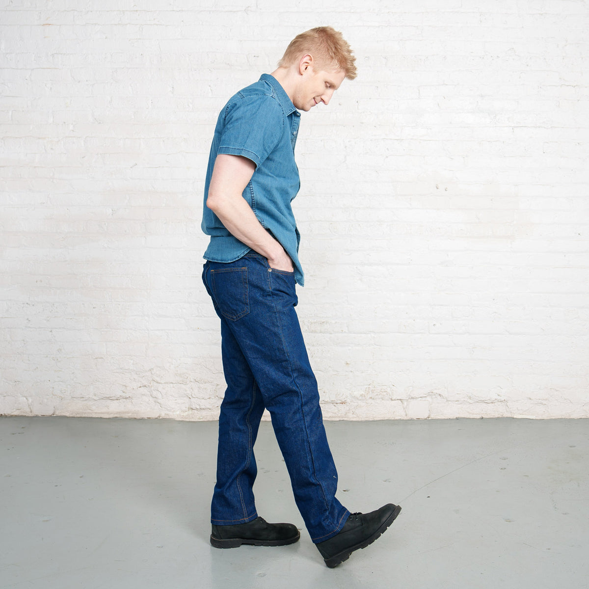 Tapered lower leg and hem of the dark wash Tailored Fit jeans