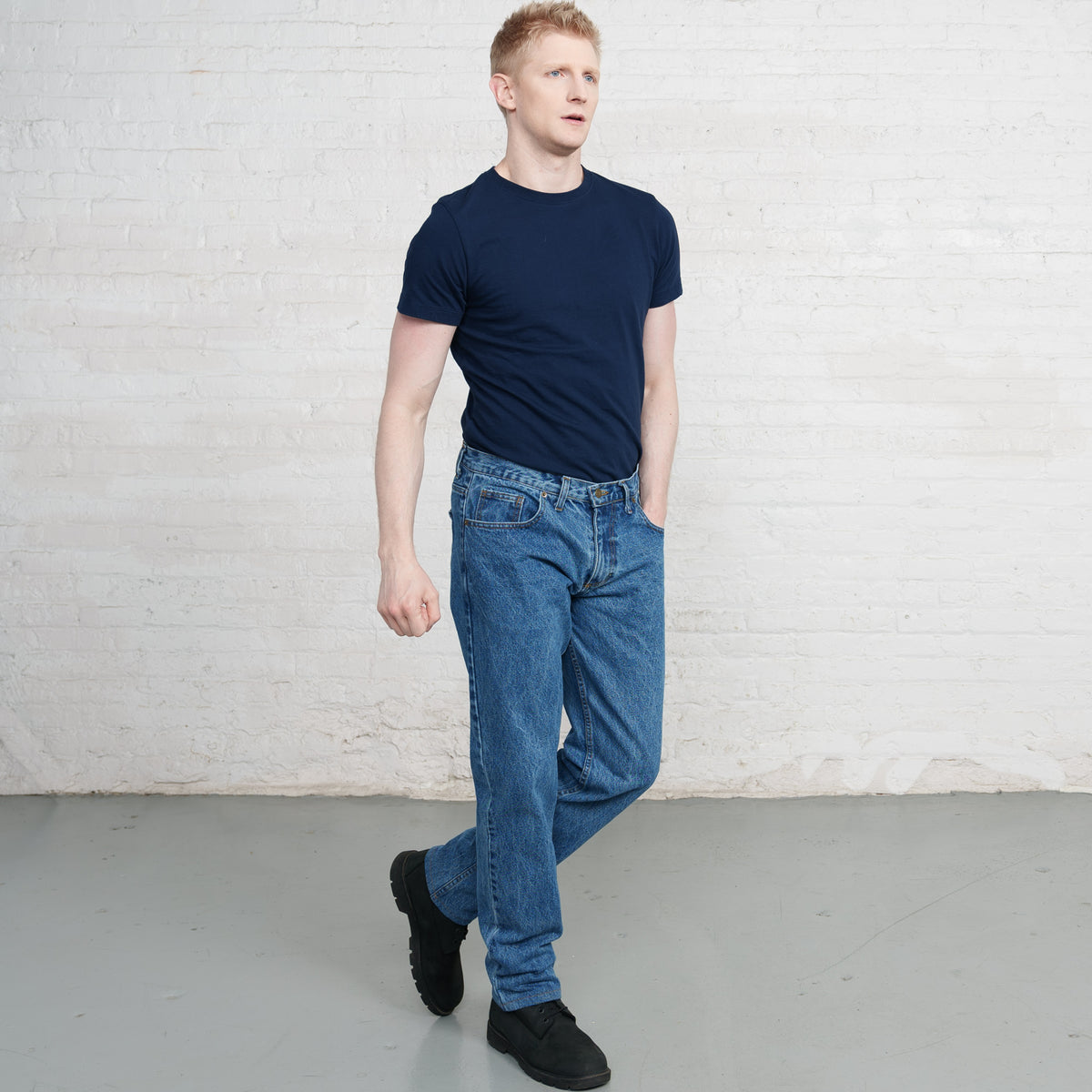 Back view of stone wash Tailored Fit jeans showing back pockets and Horween leather patch