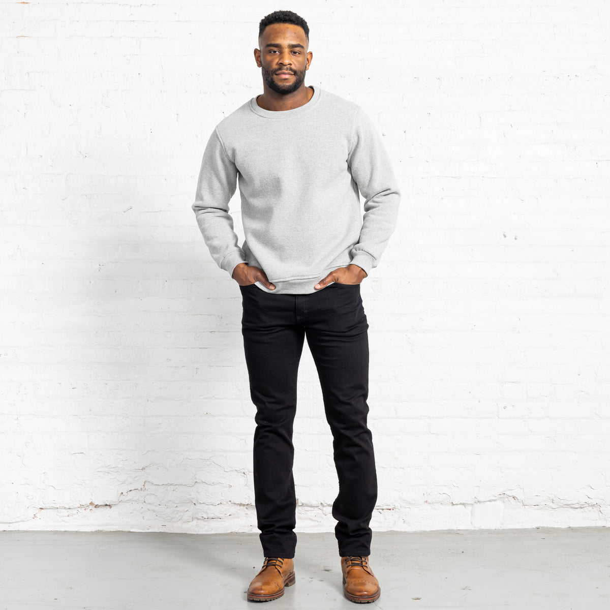 Back view of black Tailored Fit jeans showing back pockets and Horween leather patch