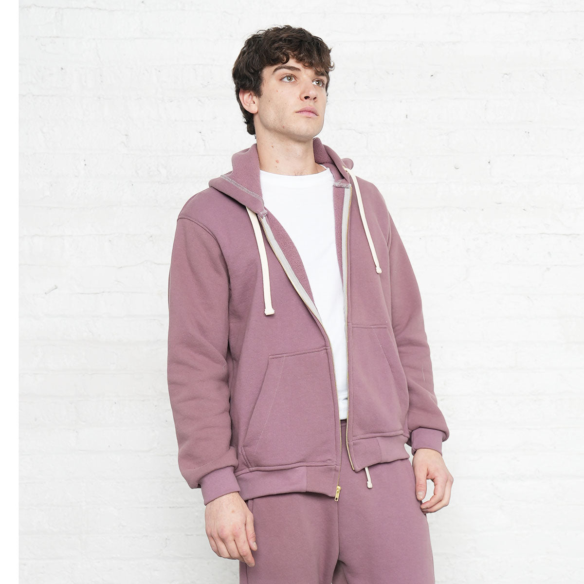 Detail of the 3 thread fleece fabric and cuff on the rose taupe zip-up hoodie